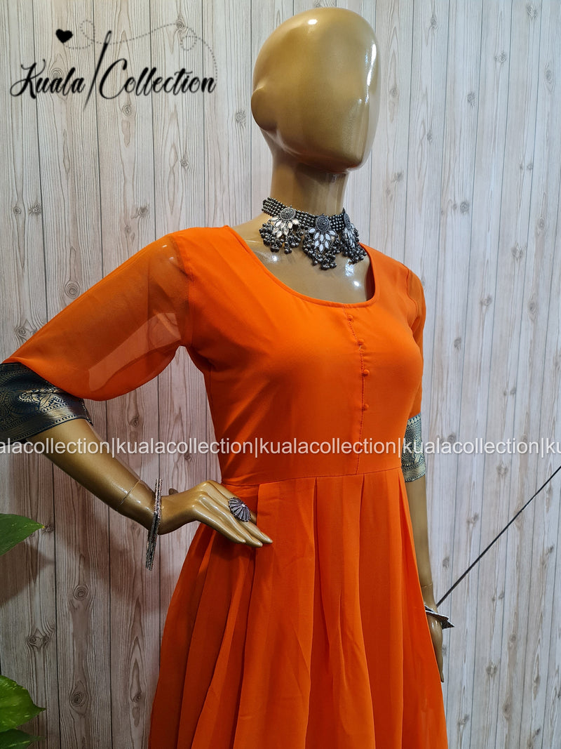 Entrancing Orange Colored  Jacquard Border Georgette Anarkali Gown By Kuala Collection