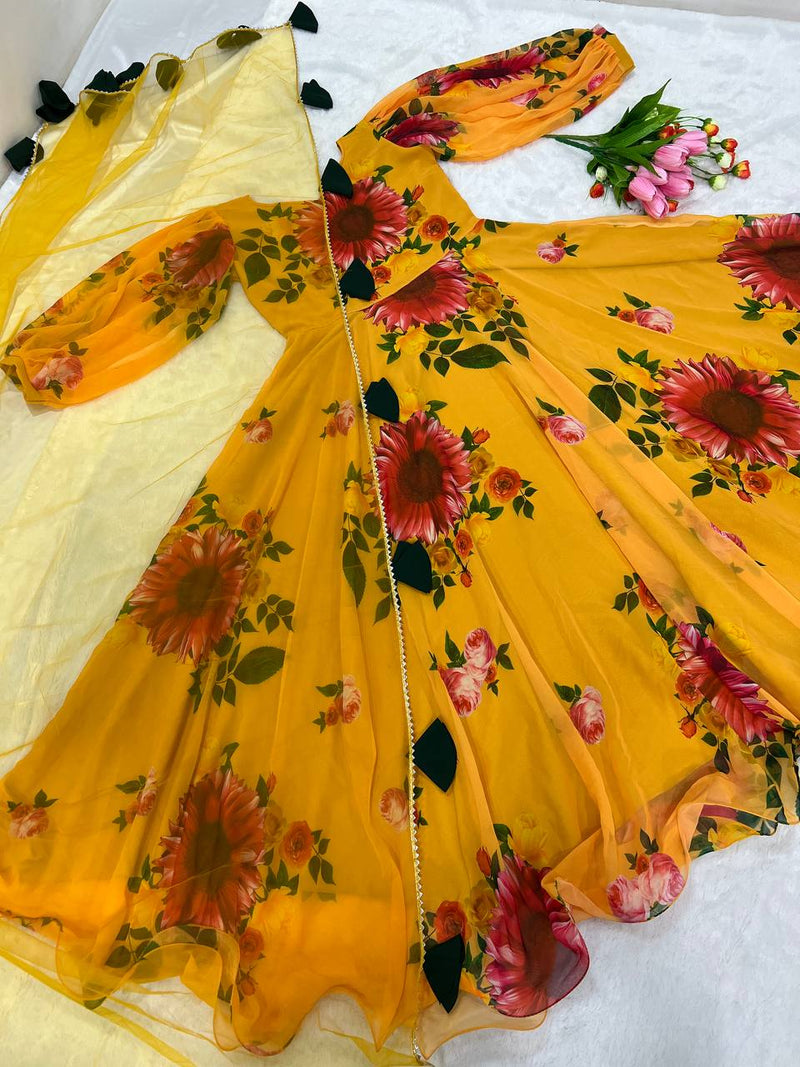 Blooming Mustard Yellow Georgette Floral Gown and Four Sided Tassels Lace Border